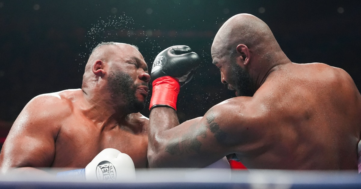 Boxer Jarrell Miller has hairpiece knocked upward by a punch, then throws it into the crowd