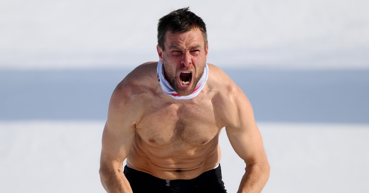 Snowboarder rips off his jersey as he takes gold