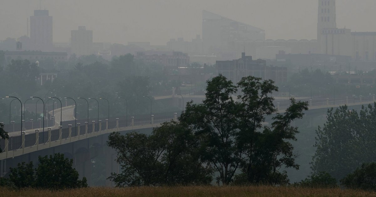 Heavy, pungent smoke from Canadian wildfires darkened skies in the U.S. on Thursday from the Great Lakes to parts of the East Coast, reducing visibility for commuters and prompting warnings that air quality could make being outside dangerous.