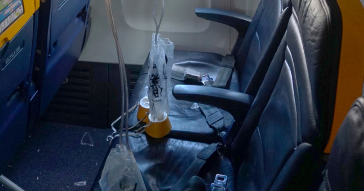 Ryanair passenger pulled back inside after engine parts shatter cabin window