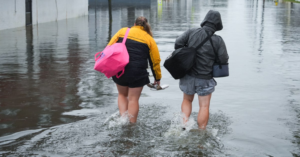 Residents of coastal communities in the Northeast slog through floodwaters as a powerful nor’easter pummels the shoreline, knocking out power to tens of thousands of homes.
