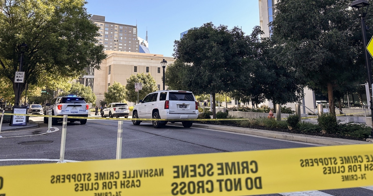 A security officer shot and killed a man armed with a pistol and knife just inside the entrance of a federal courthouse in Tennessee, authorities say.