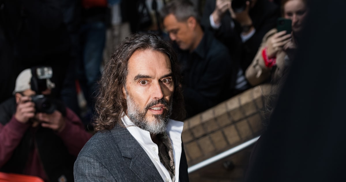 Russell Brand arrives at a London court for his trial on rape and sexual assault charges