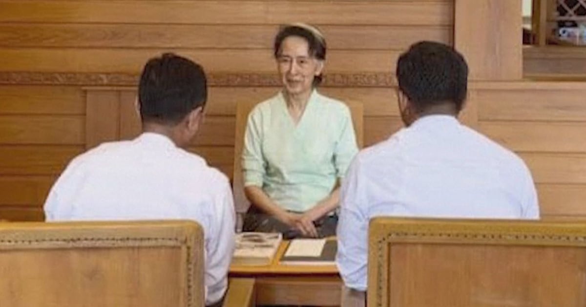 Rare photos of Myanmar’s ex-leader Aung San Suu Kyi show her receiving books sent by King Charles