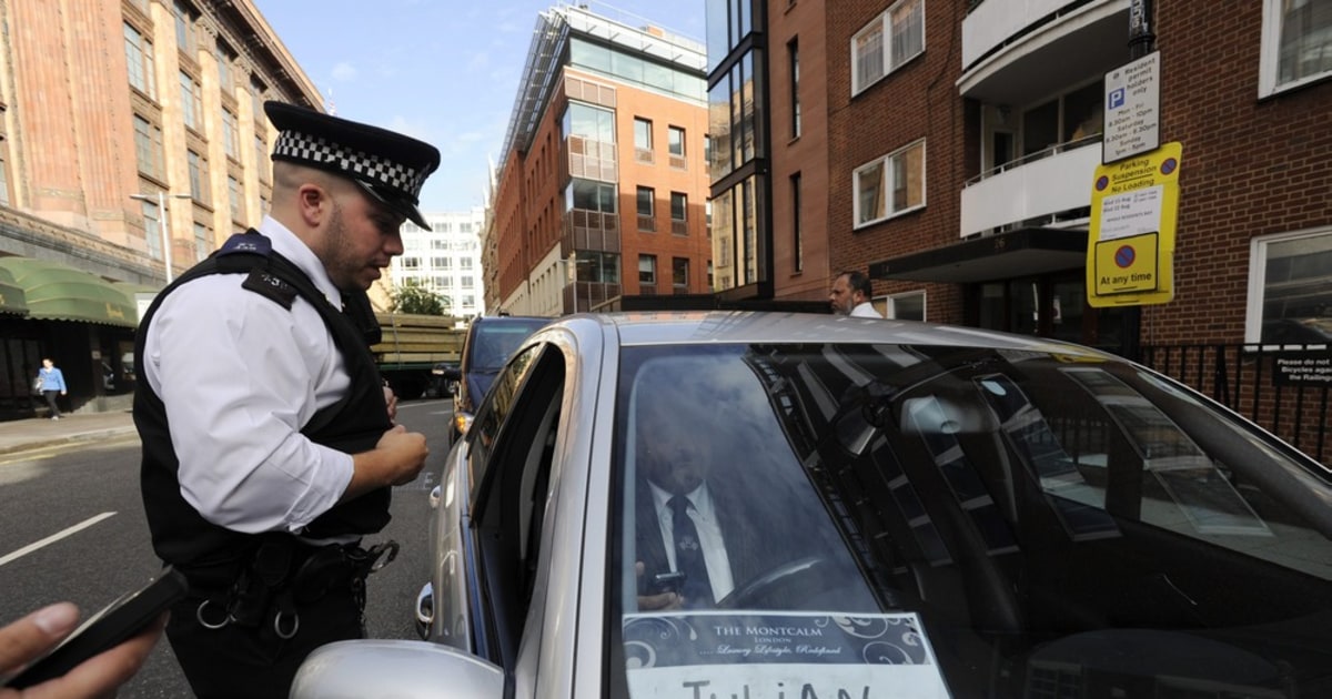 Taxi for Julian Assange? Supporters scuffle with cops outside Ecuador ...