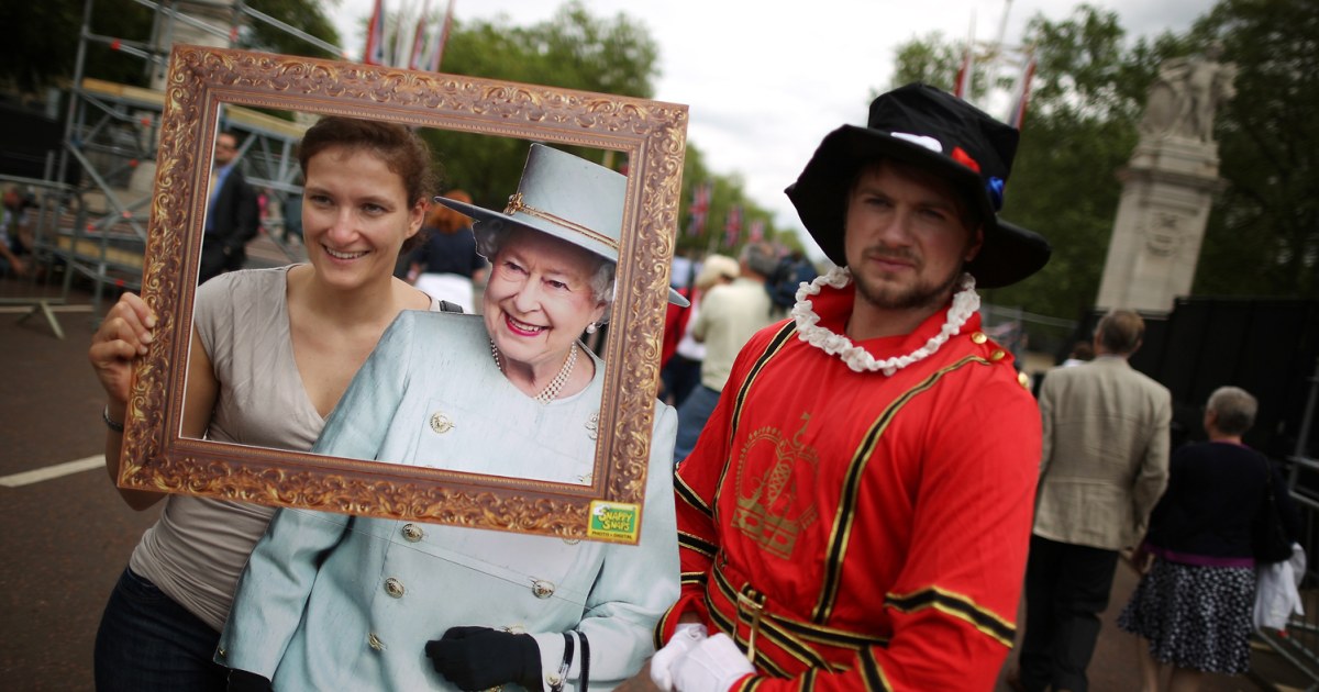 Say cheese! A cardboard queen patiently poses for portraits