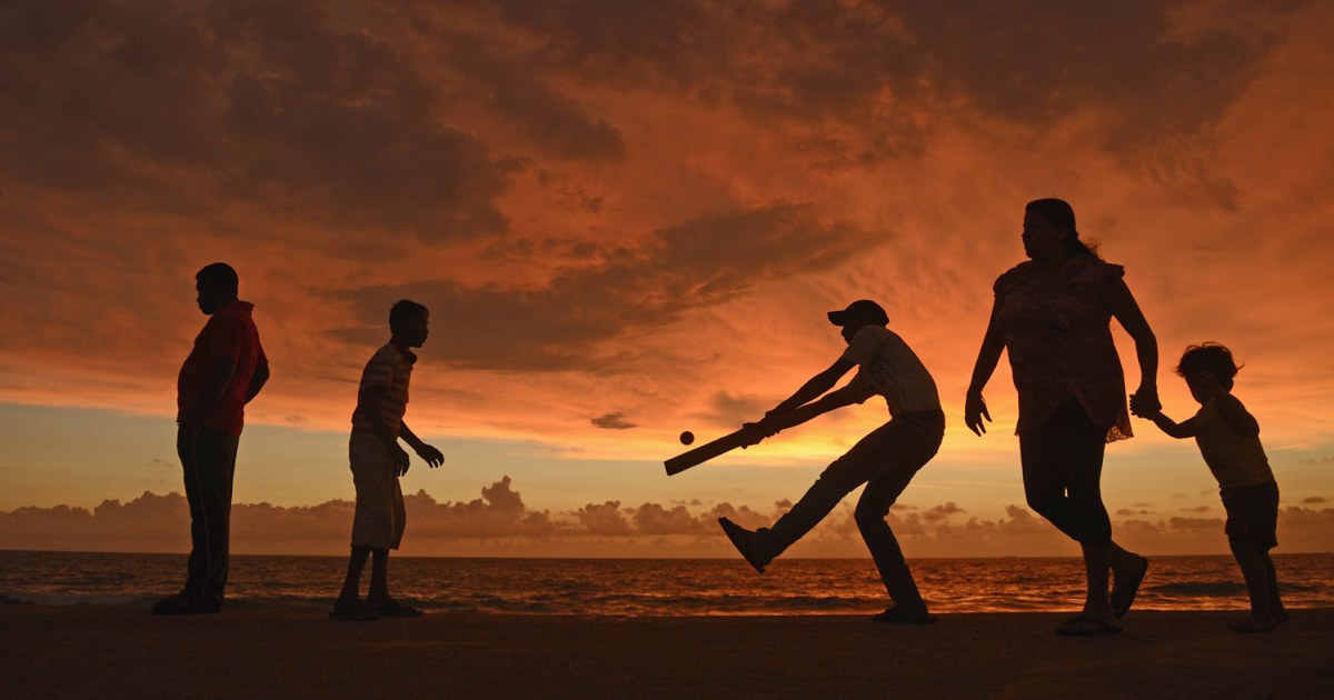 Cricket on the beach under an electric-orange sky