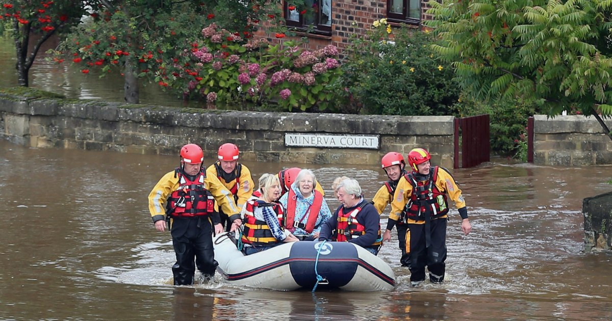 Keep calm and drink beer? Brits carry on in rising flood waters