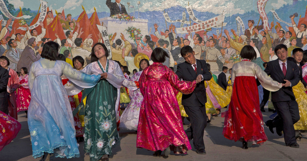 North Koreans celebrate their rulers with song and dance as world
