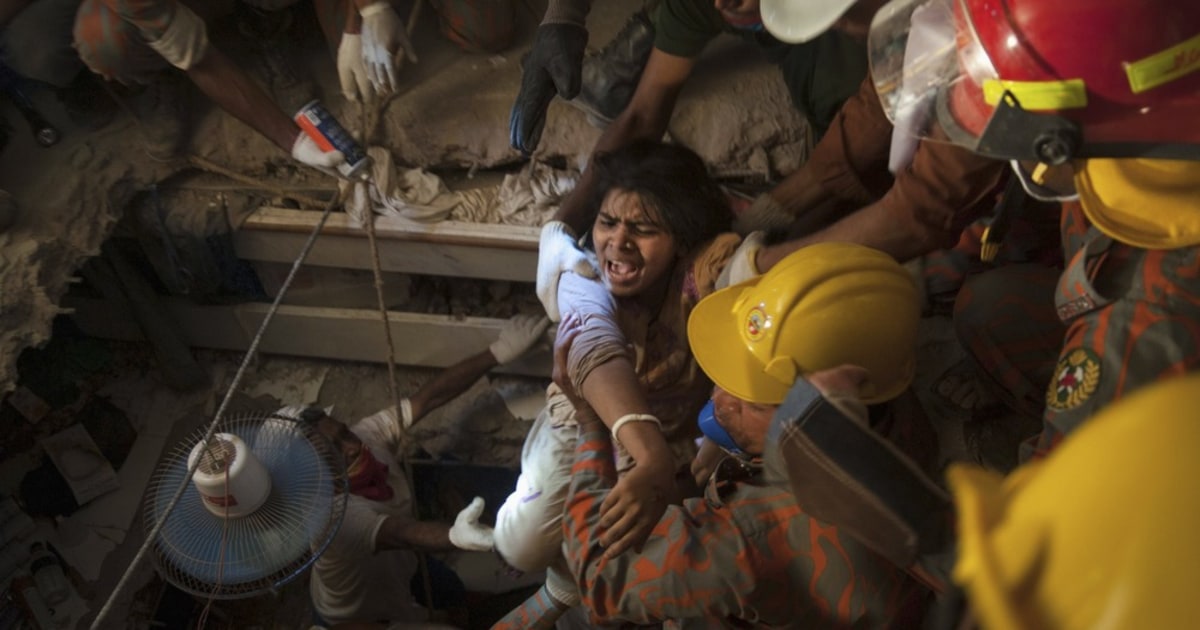 Trapped garment worker rescued from rubble of collapsed factory ...