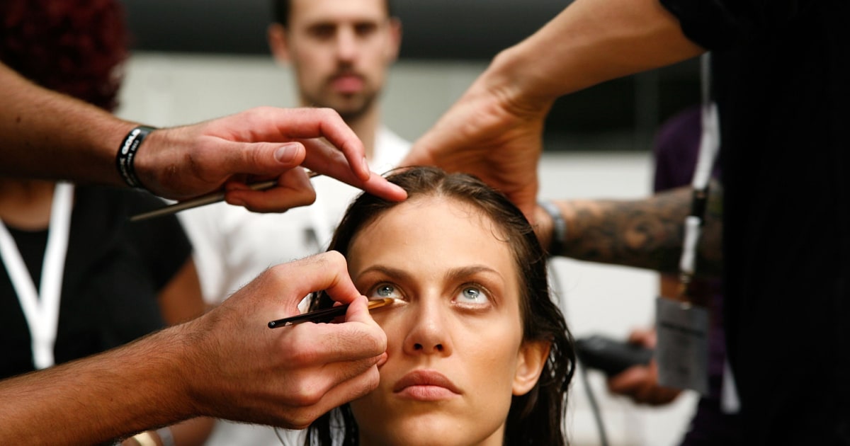 Models prepare backstage at Fashion Week in New York City