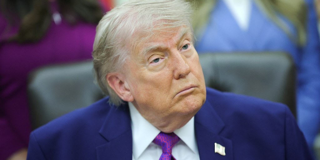 Trump explains that he doesn’t think about the American financial situation, seen here standing in front of the American financial situation he’s not thinking about.