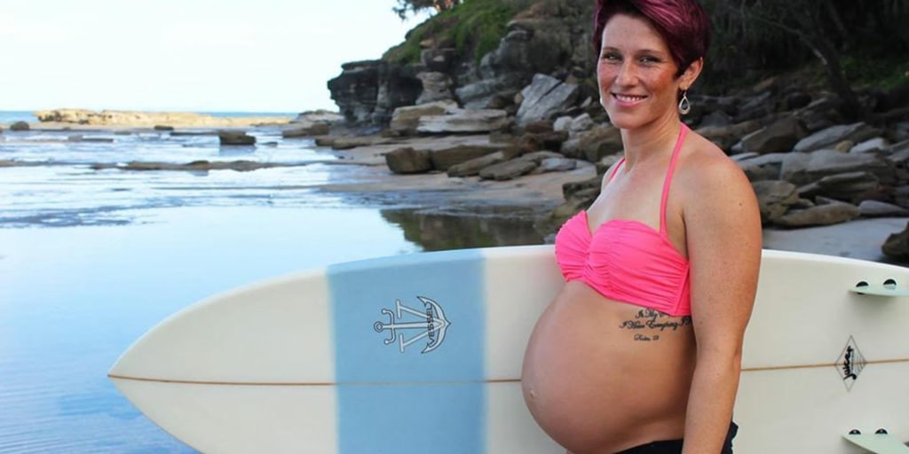 36 Week Pregnant Surfer Rides Tandem Waves with Pro Husband to Prove Motherhood Doesnt Mean Stopping 2 Mom surfed during pregnancy saying it makes her fit, happy