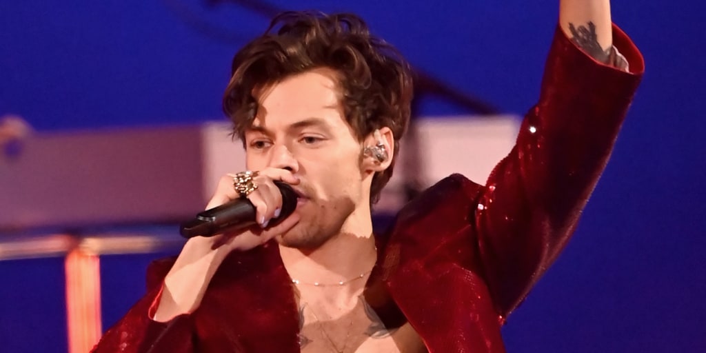 Harry Styles hit in face again by object thrown at concert