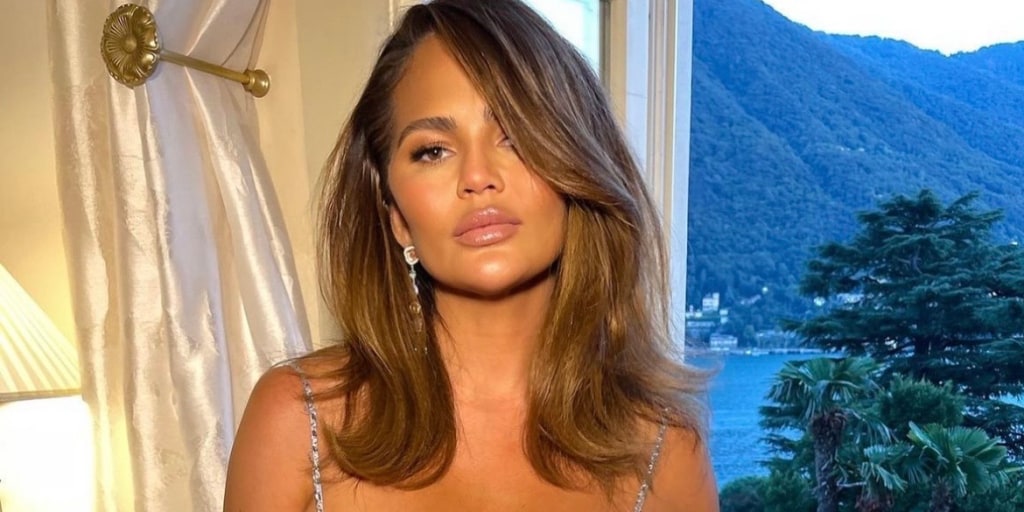 Chrissy Teigen Wears Silver Dress for 10th Wedding Anniversary  Celebrations: Photo