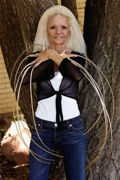 Woman with record-breaking 24ft nails has cut for 1st time in 30 years |  Metro News