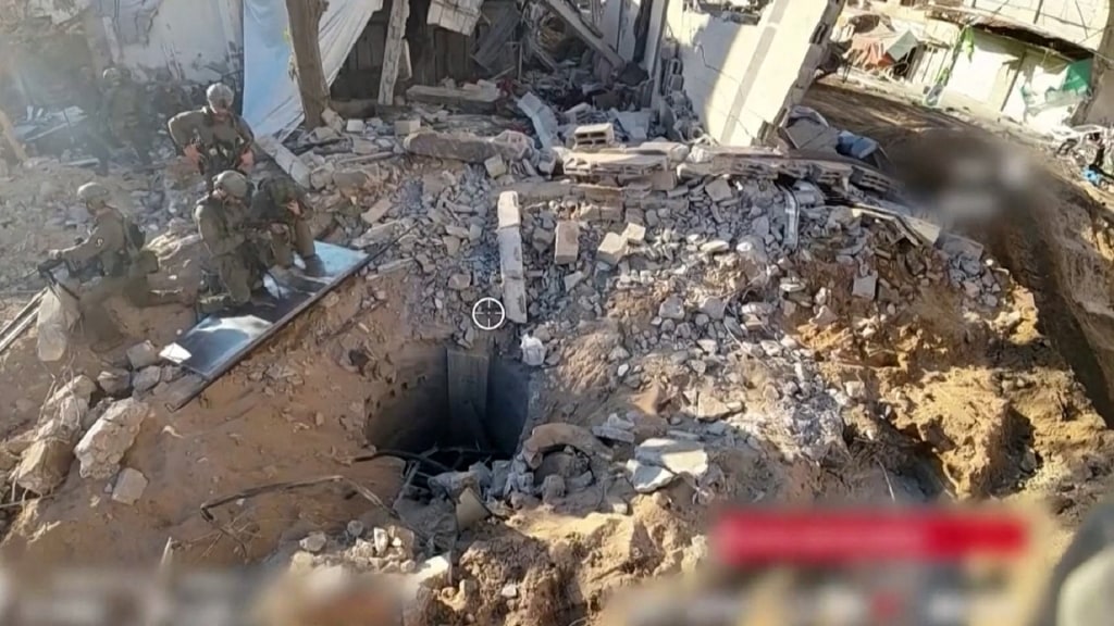 Israel says videos show hostages and a tunnel at Al-Shifa hospital