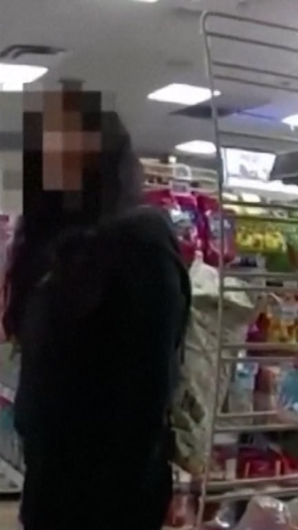 Woman's hand signal for help leads to arrest