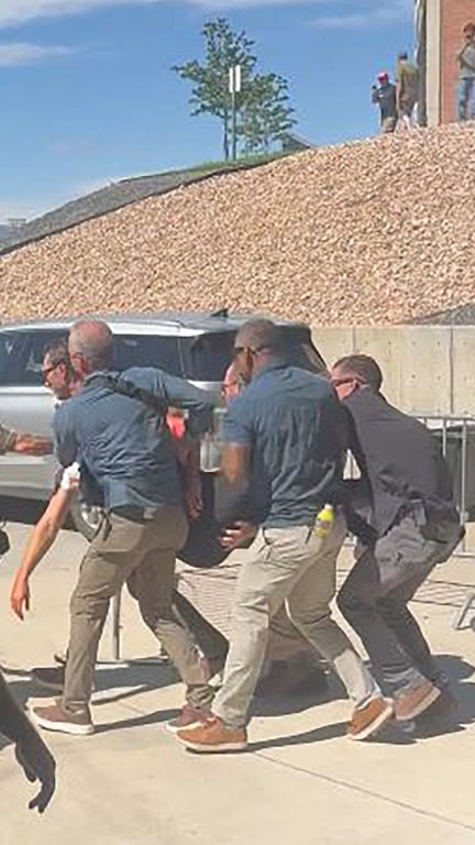 Charlie Kirk carried away after fatal shooting