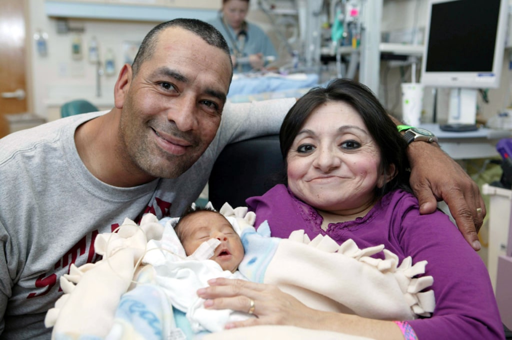 Vazquez holds his new baby, 02/12/2020