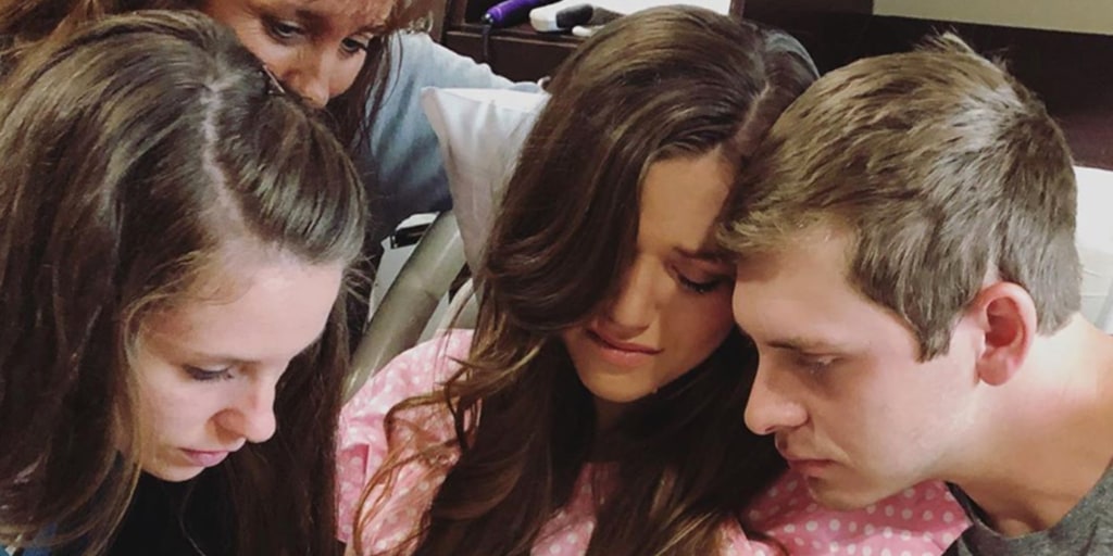 Joy-Anna Duggar holds daughter she lost in heartbreaking photos