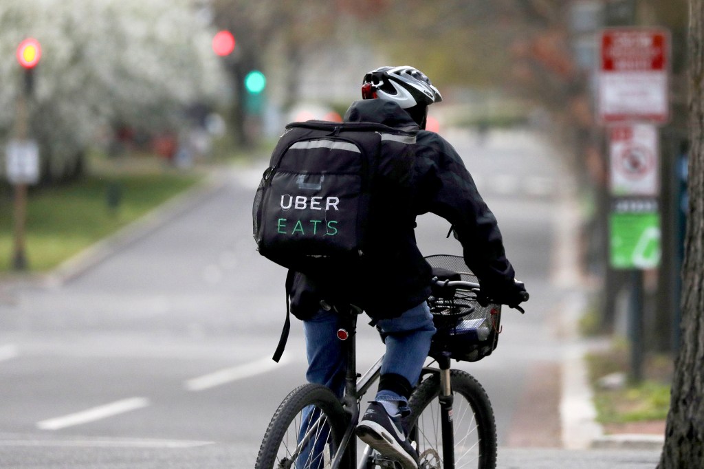 Uber buys Postmates in deal where restaurants delivery people and