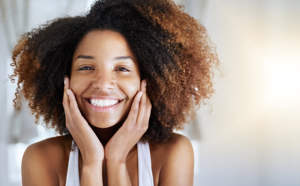 Toned woman smiling after fitness hi-res stock photography and