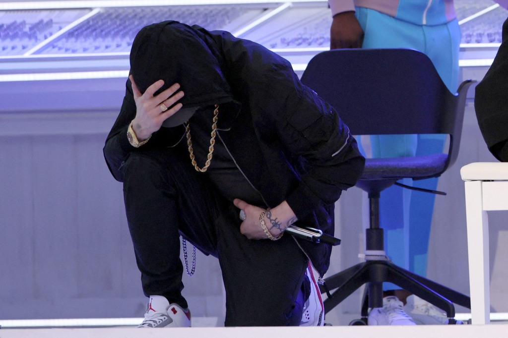 Eminem takes a knee during Super Bowl halftime performance