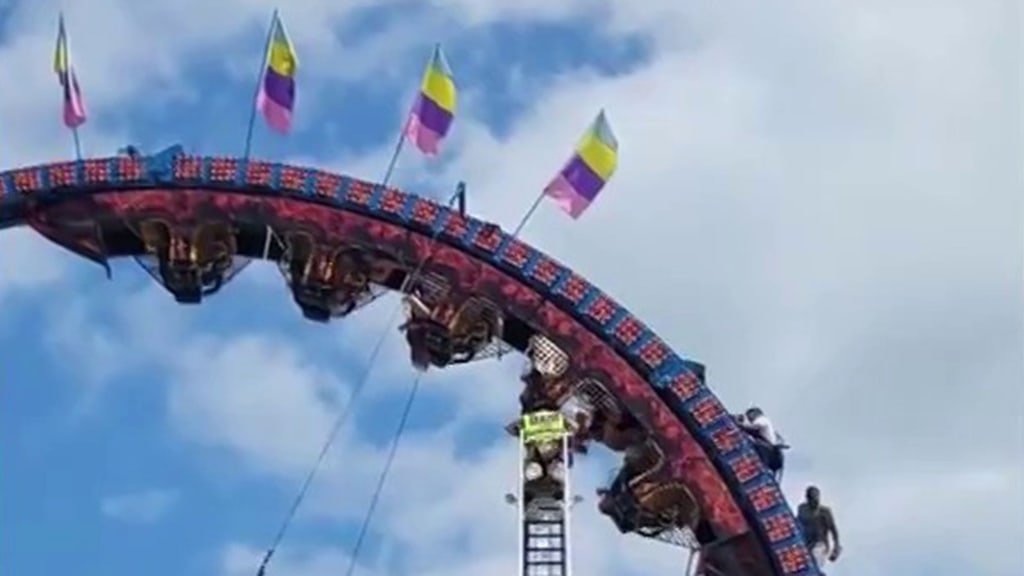 Roller coaster riders stuck upside down for hours after