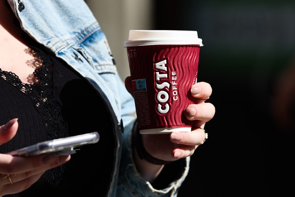 A man proved a large cup of Costa coffee fits into a regular cup