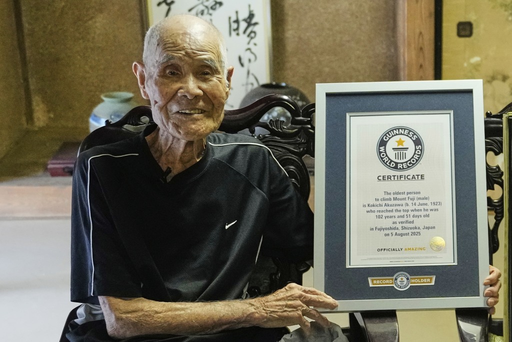 Japanese man becomes oldest to summit Mount Fuji at 102 with help