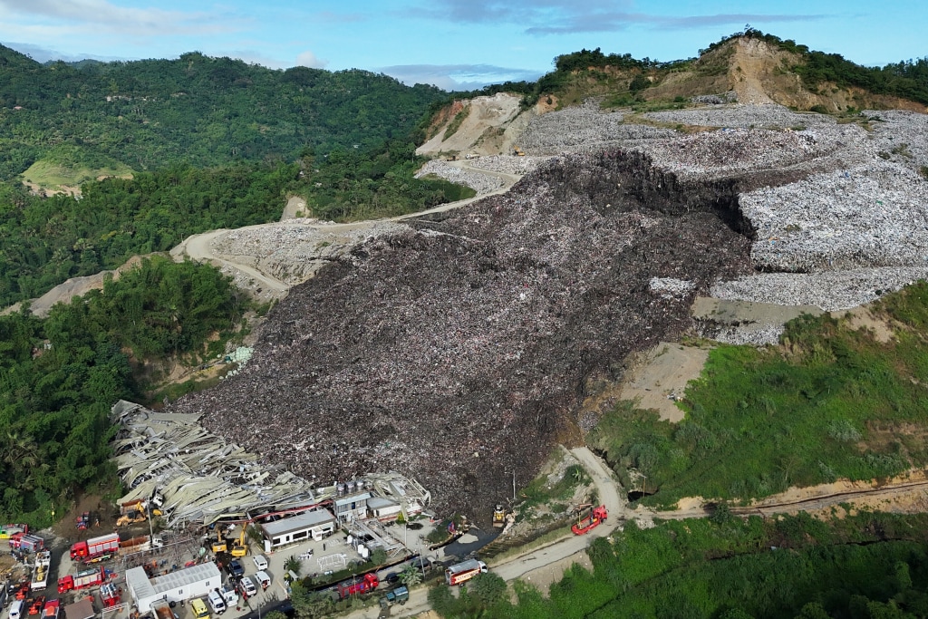 Mound of garbage collapses at Philippine landfill, burying and trapping 38 people and killing 1