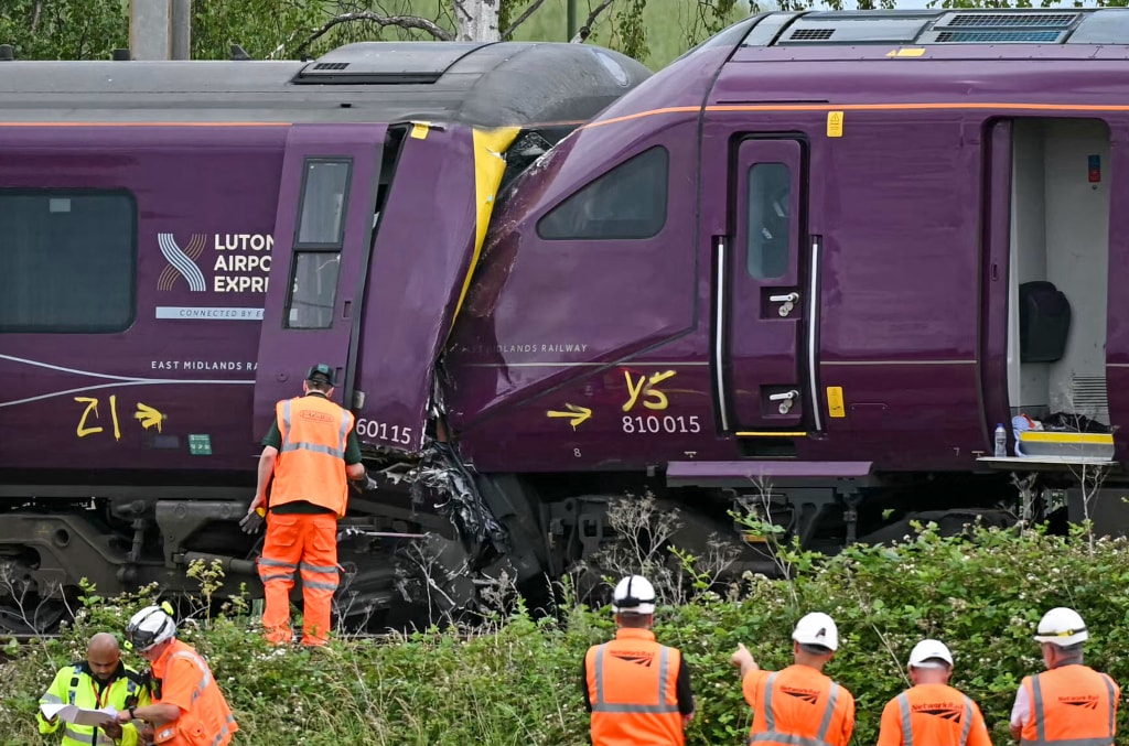 Two trains collide north of London, killing at least 1 person and injuring  dozens
