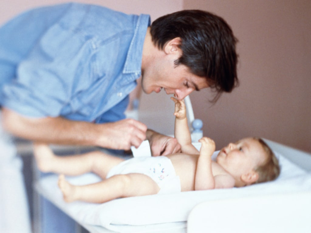 Dad changing hot sale baby diapers