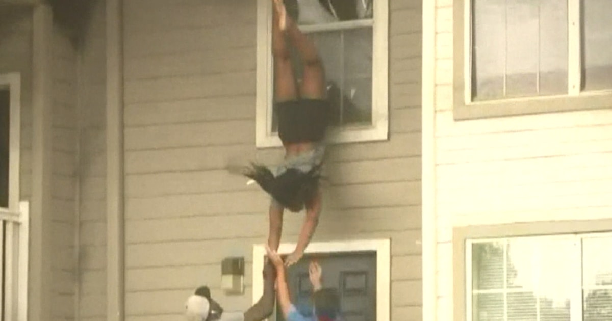 Watch: Residents jump to escape apartment fire