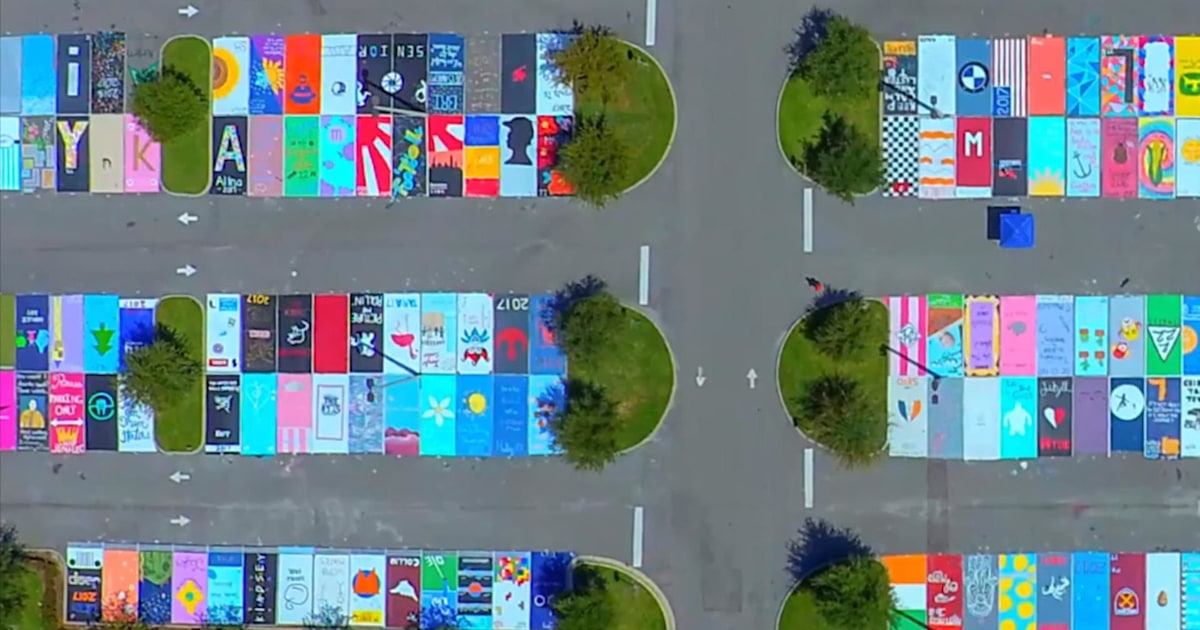 High school seniors paint parking spaces into beautiful works of art