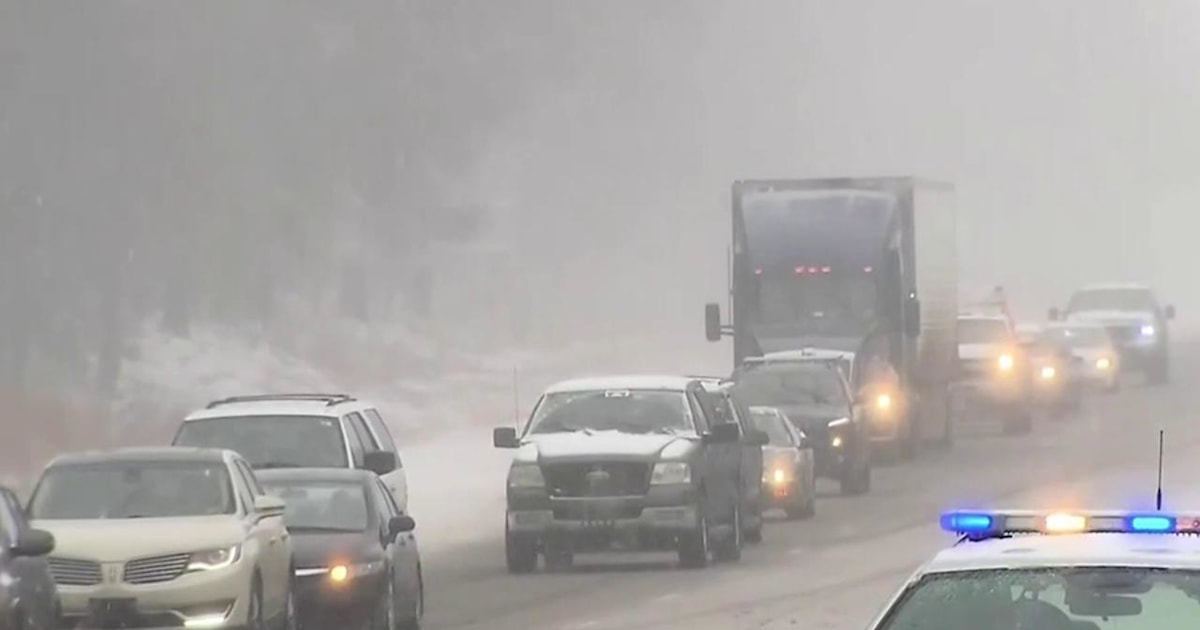 Winter storm blankets East Coast with snow as flooding is expected out west