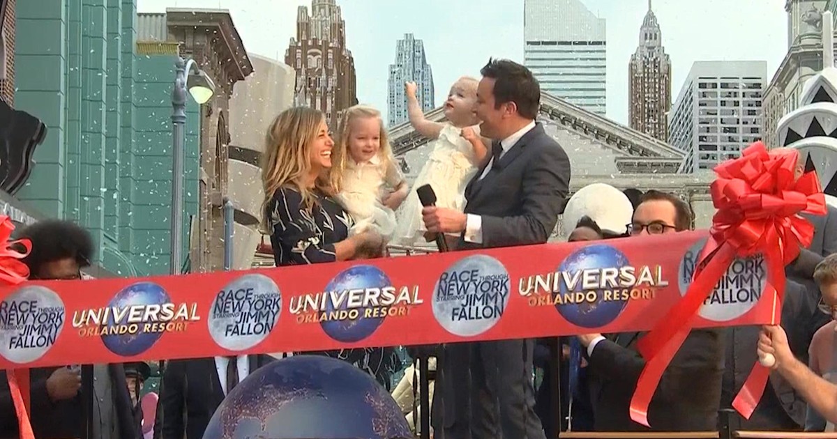Jimmy Fallon, with his family by his side, cuts the ribbon to his Race Through New York thrill ride