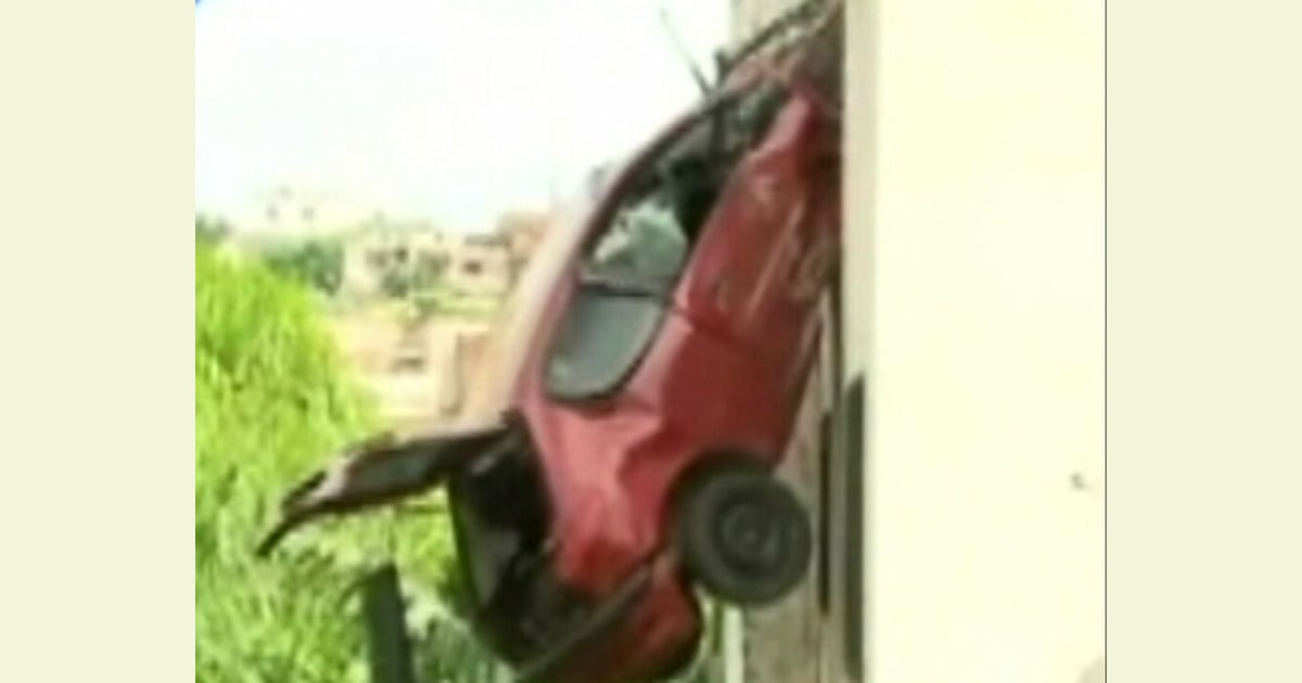 Car flies into air, crashes into side of house