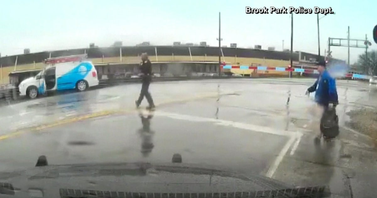 Watch: Officer saves man from being hit by train