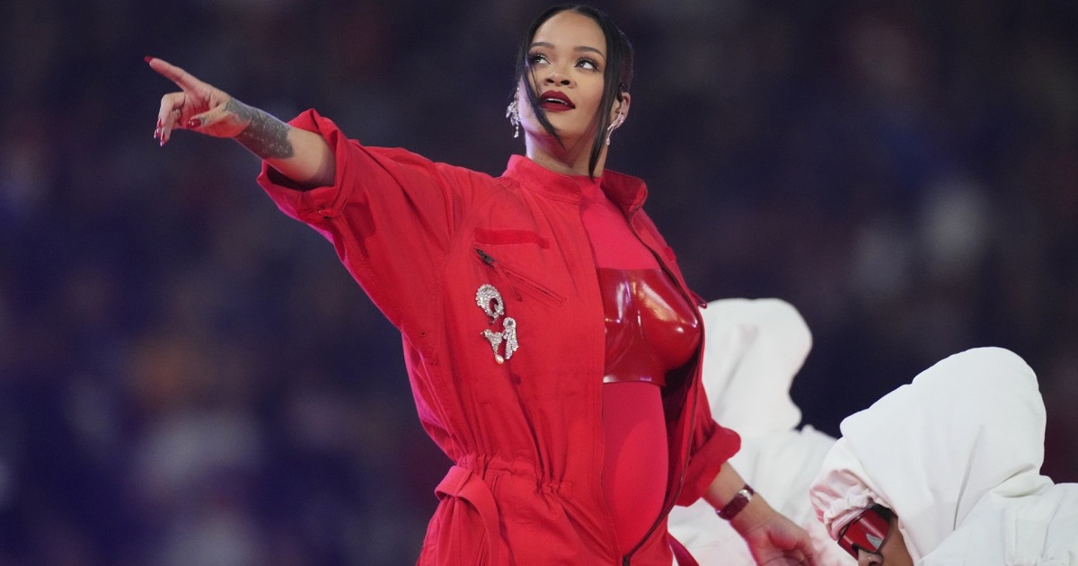 Rihanna cradles baby bump after pregnancy reveal at Super Bowl