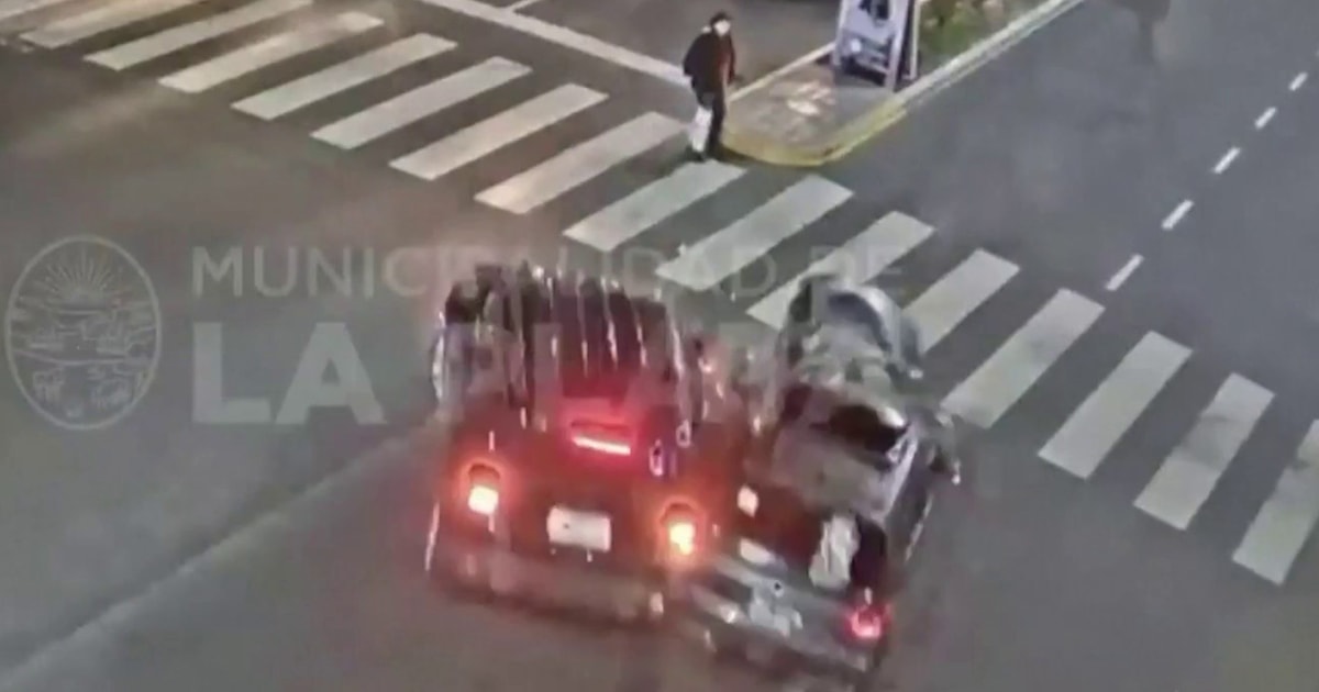 Watch: Woman crossing street narrowly avoids car collision