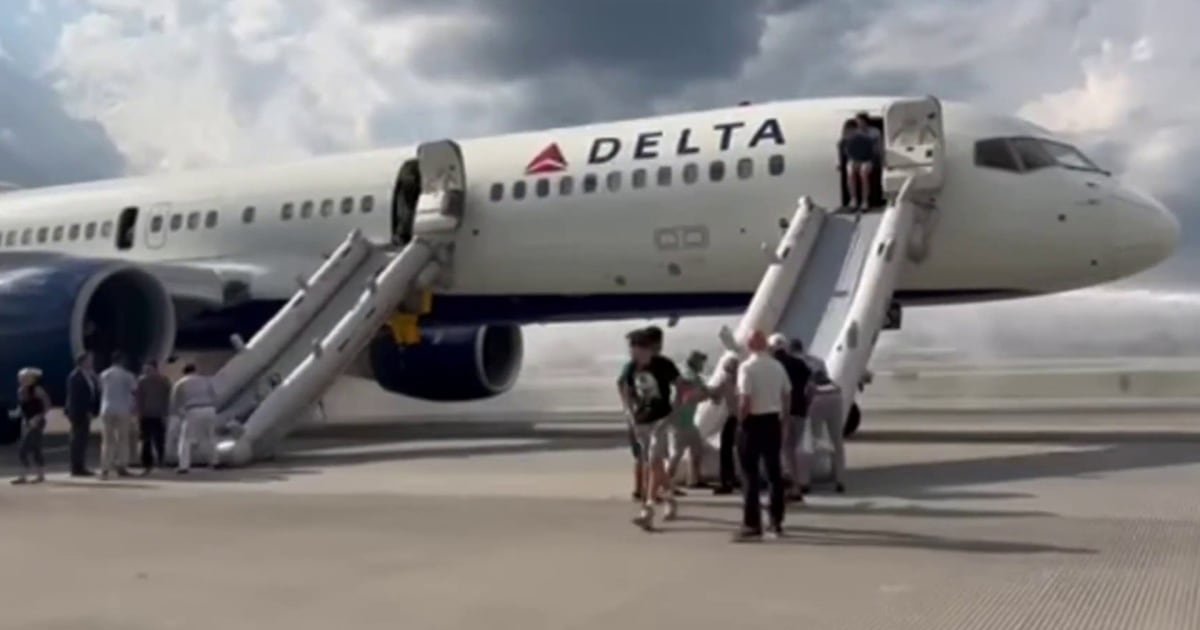Delta passengers evacuate plane after tires blow out during landing