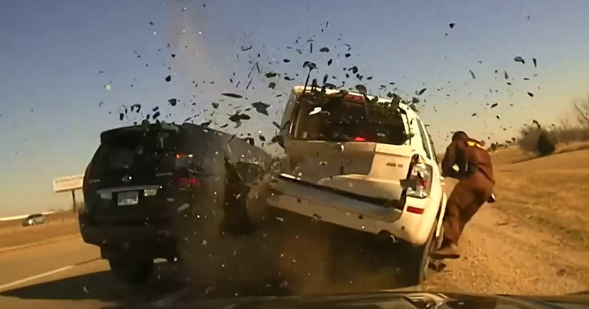 Video: SUV slams into vehicle during traffic stop
