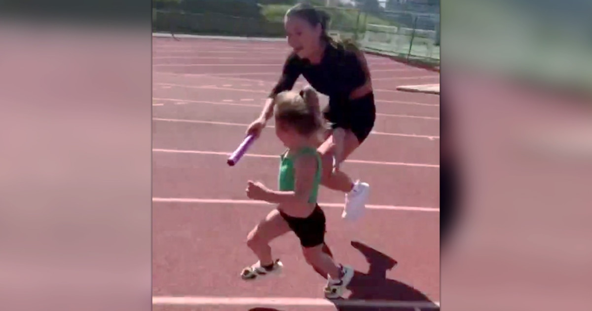 Watch cute mishap during baton pass between mom and daughter