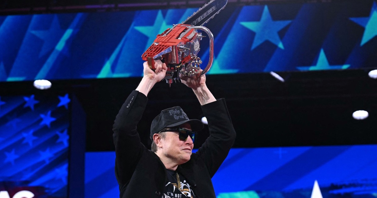 Musk boasts federal cuts by hoisting chainsaw at conference