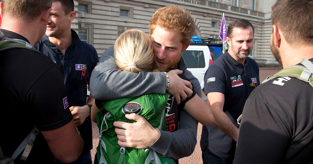 Prince Harry greets wounded veterans finishing 1,000mile walk at