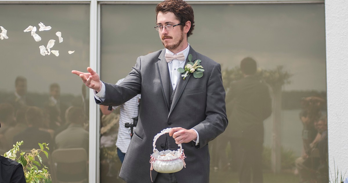 Flower man Patrick Casey tosses rose petals at wedding like a pro