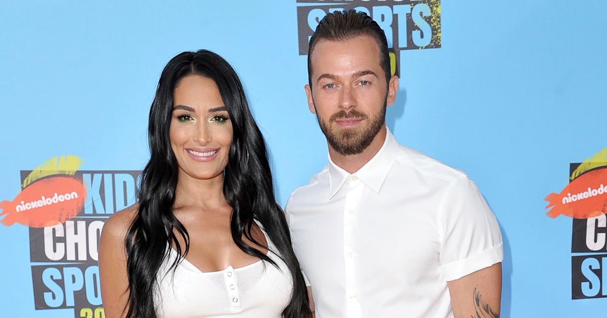 Nikki Bella wears white as she weds fiancé Artem Chigvintsev in