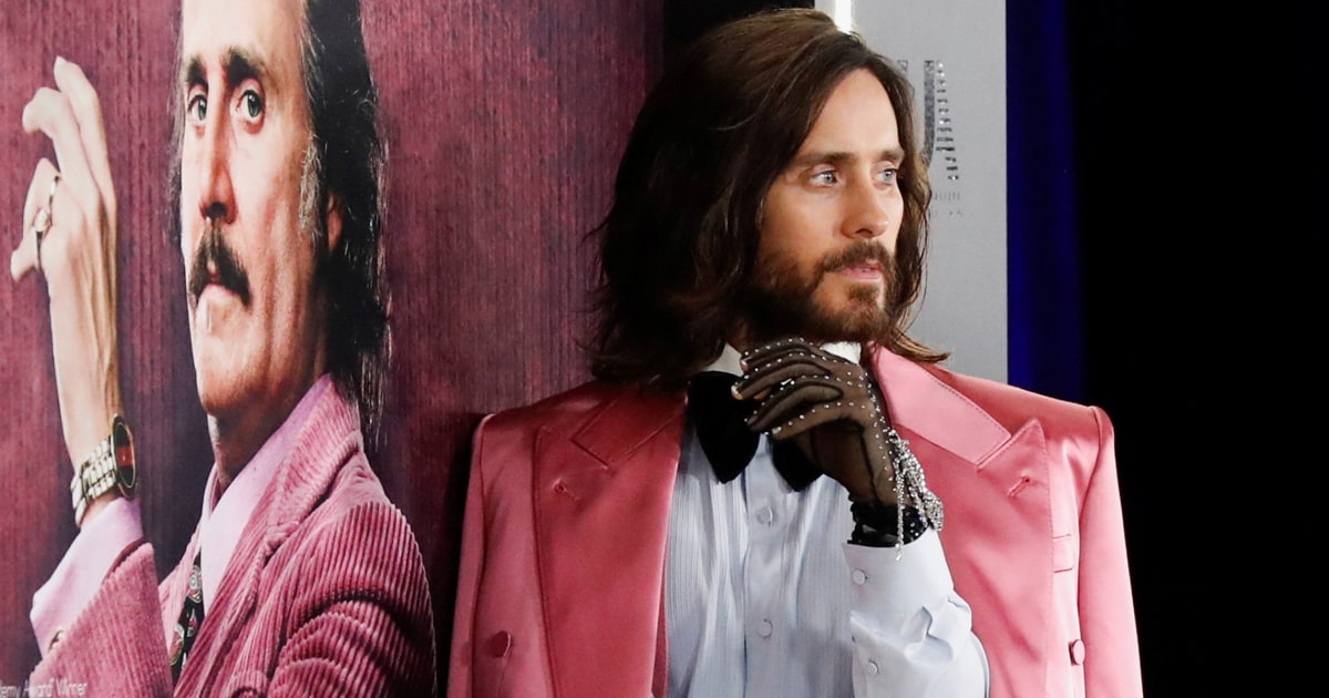 Jared Leto pairs pink suit with jeweled Gucci black gloves